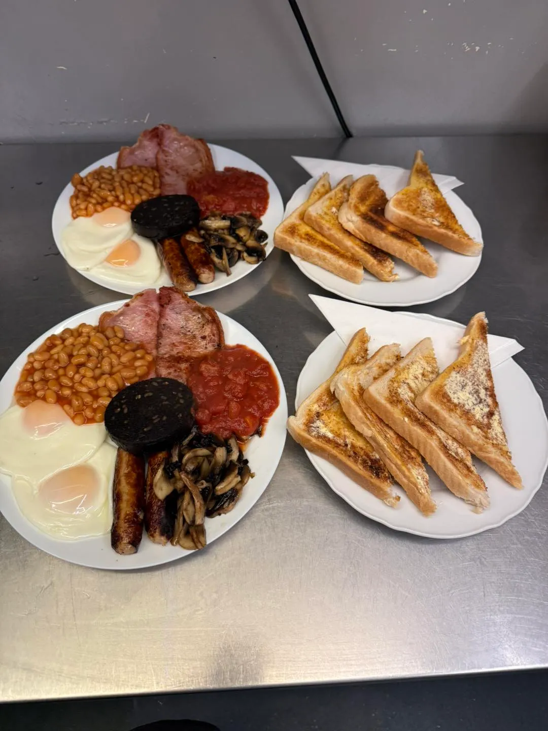 Two full English breakfasts served with buttered toast at Hucknall Cafe