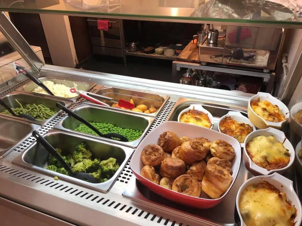 Our hot counter with Yorkshire puddings, roast potatoes, mash, peas, broccoli and green beans