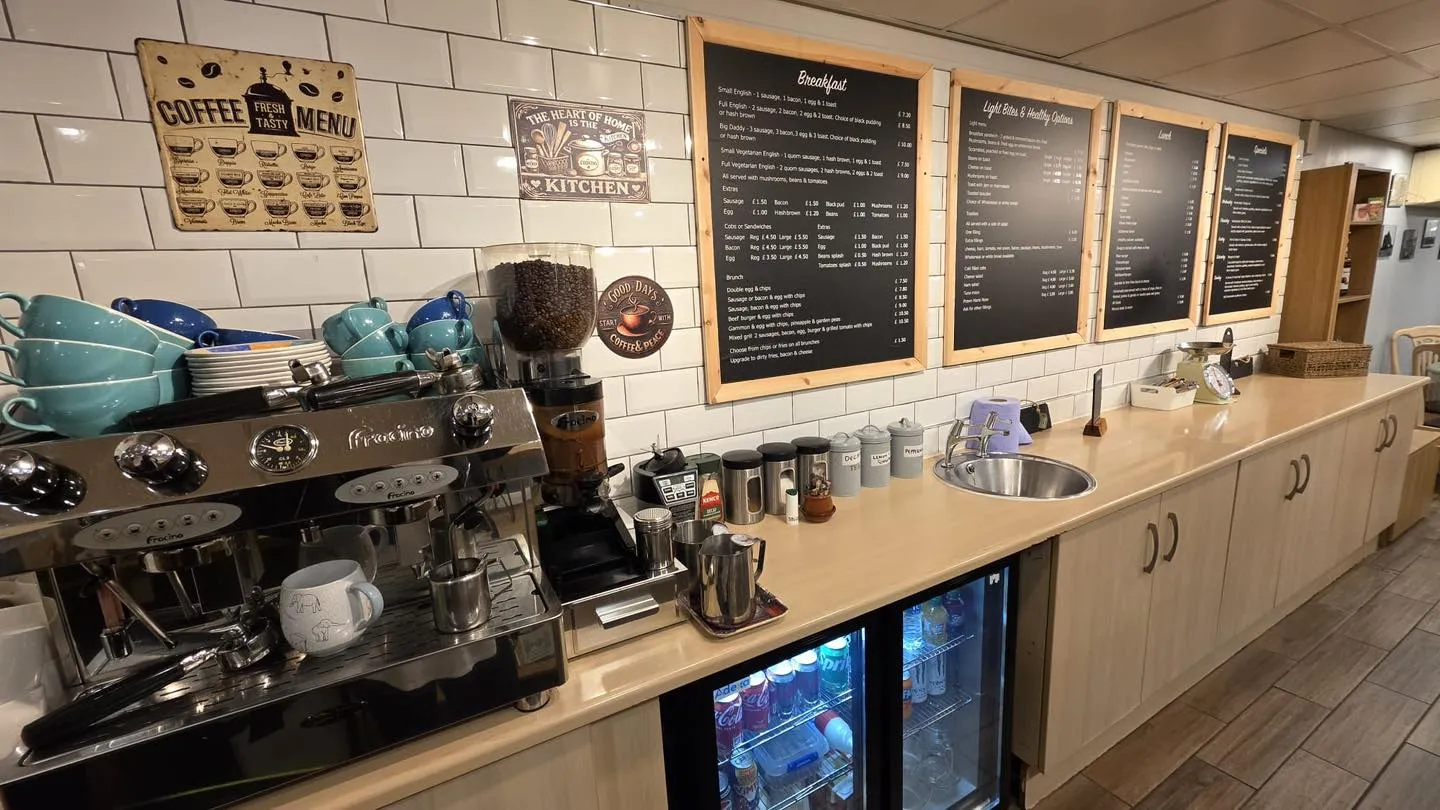 The counter with espresso machine and chalkboard menus