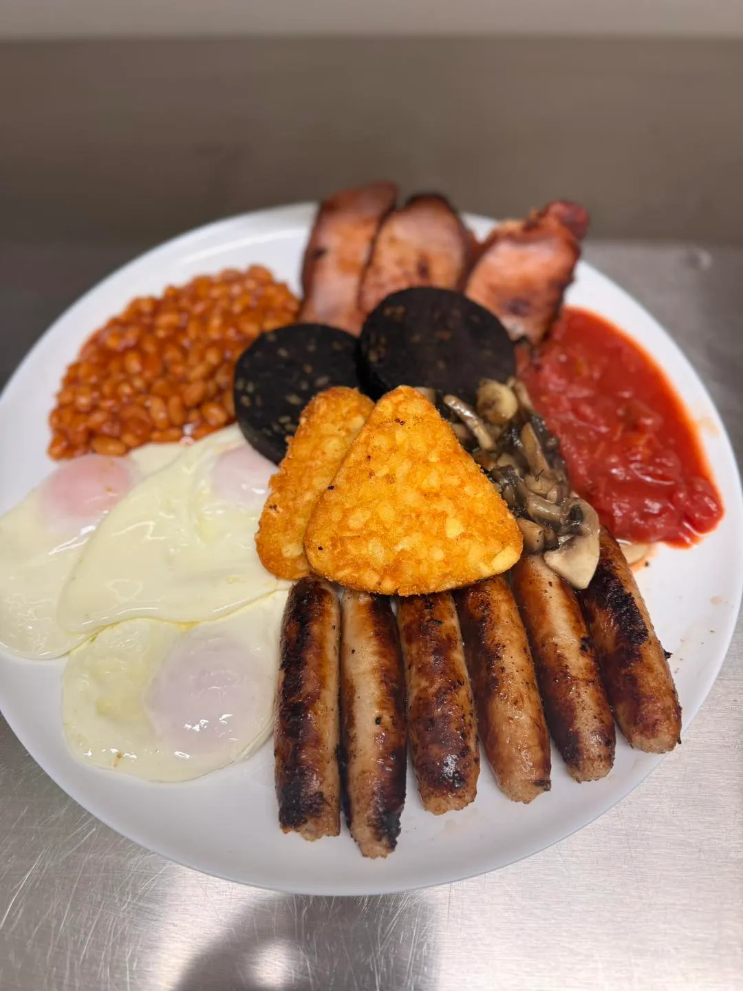 Loaded plate of a full English breakfast