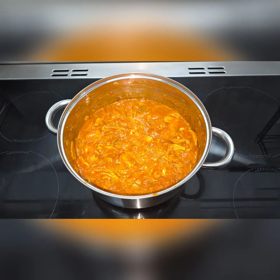 Pot of homemade chicken curry on the stove