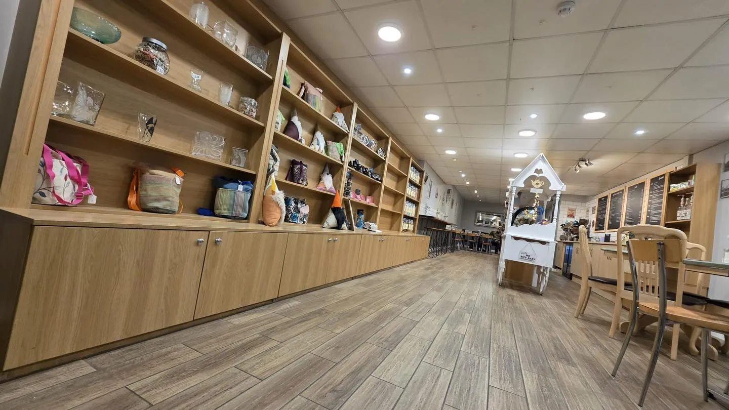 Gift shop shelving and deep view through the cafe