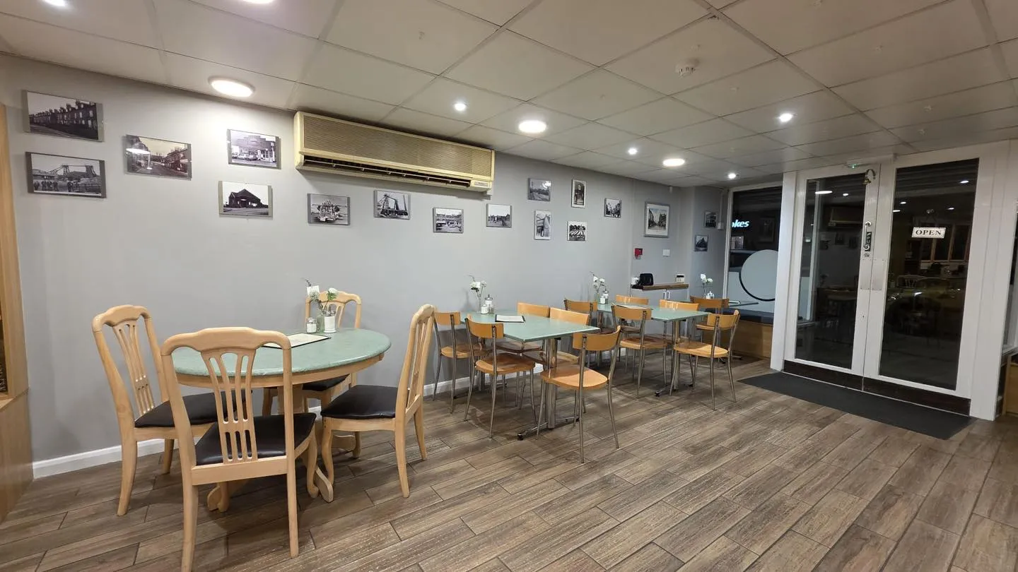 Cozy interior of Hucknall Cafe with vintage photographs on the walls