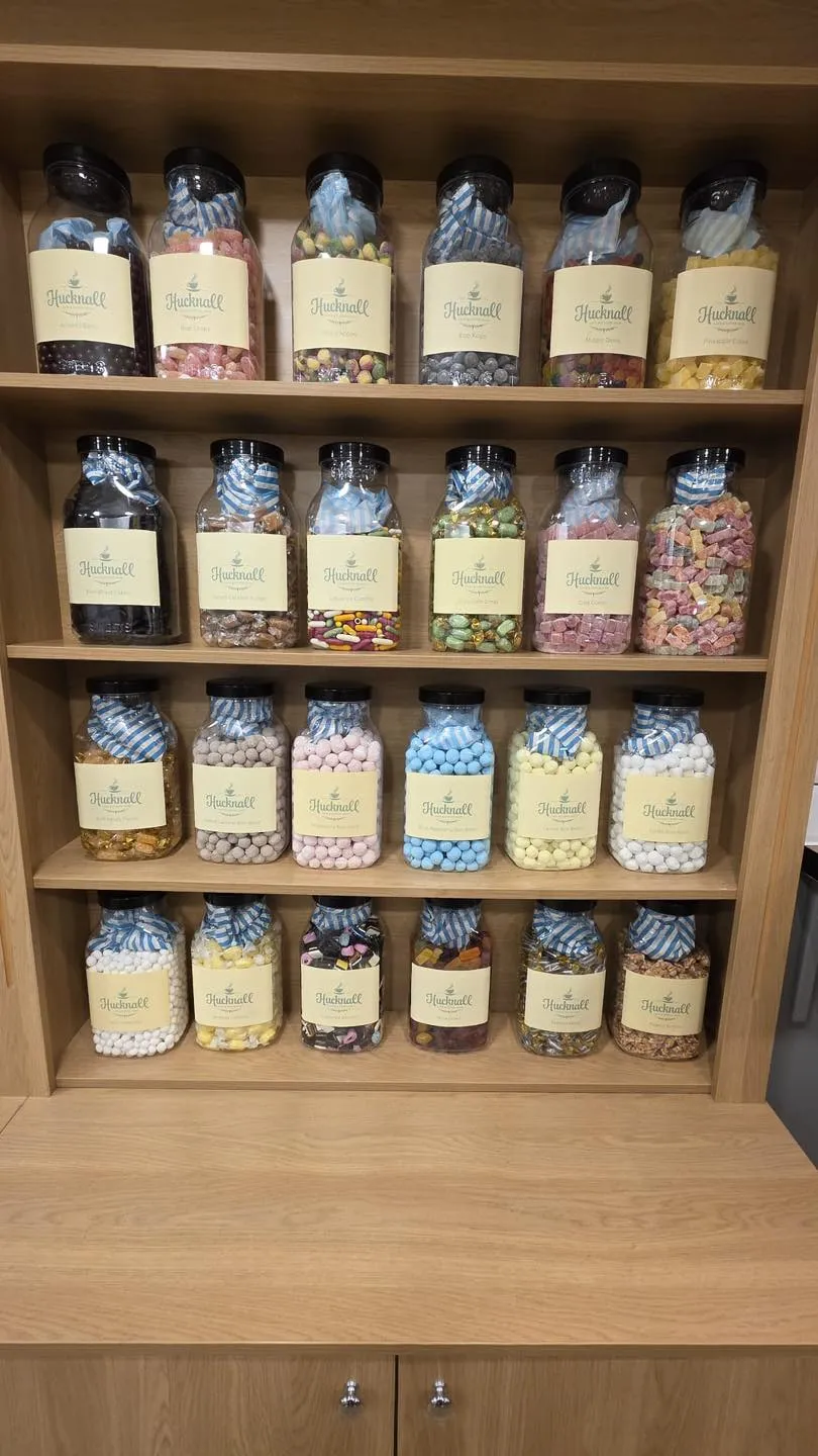 Shelves of branded Hucknall Cafe sweet jars in every colour