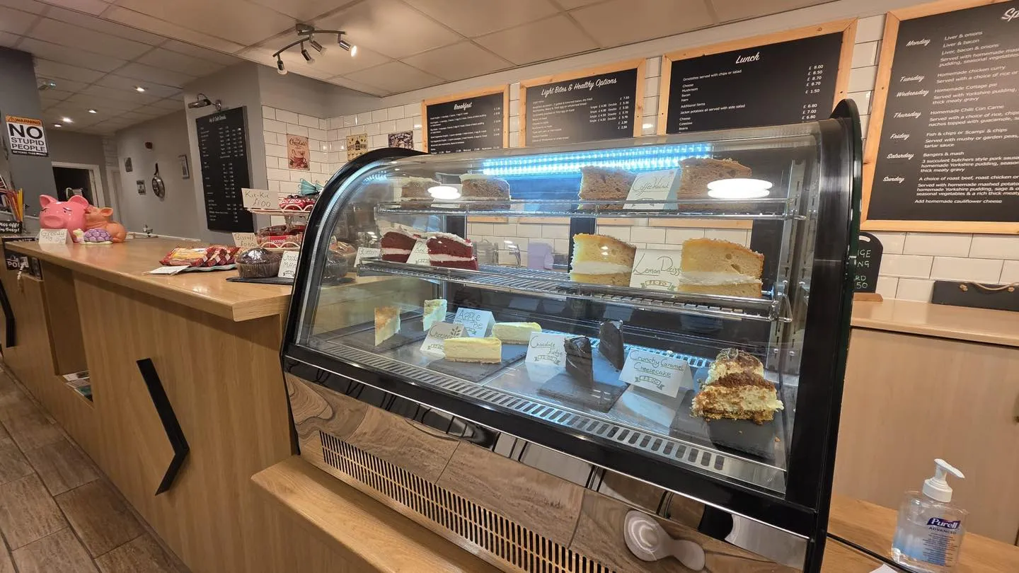 Glass counter filled with homemade cakes and bakes
